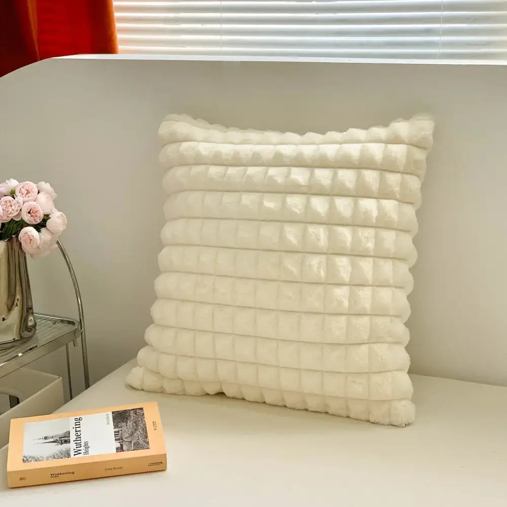 Cream-colored plush cushion cover with quilted textured surface featuring horizontal ridges by DecorBites abstract art line