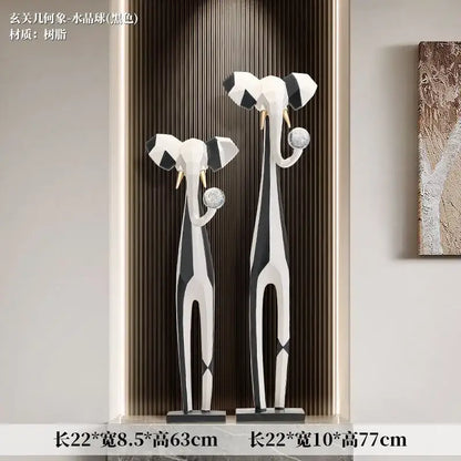 Two modern abstract art elephant sculptures with black white geometric patterns and gold tusks for living room decorbites abstract art