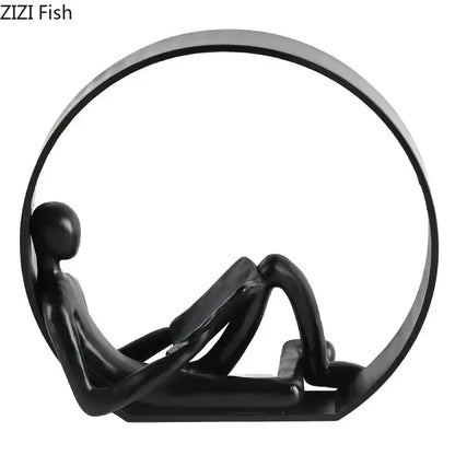 Black glossy resin abstract black characters sculpture of a minimalist human figure reclining in circular frame for decor