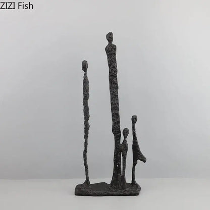 Dark gray textured decorbites abstract cast iron figure sculpture of four stylized human figures on a shared base