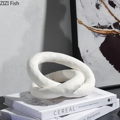 White ceramic abstract ceramic knot sculpture with intertwined loops by DecorBites for room aesthetic decor
