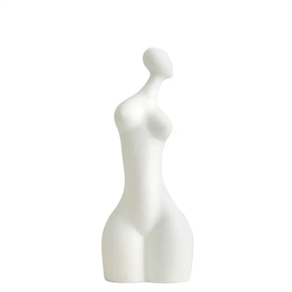 White ceramic sculpture of a stylized female figure with smooth contours from decorbites abstract ceramic sexy collection