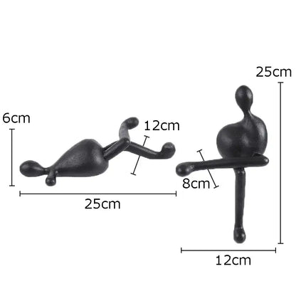 Black matte abstract characters resin sculptures by DecorBites featuring reclining and seated figures for modern decor