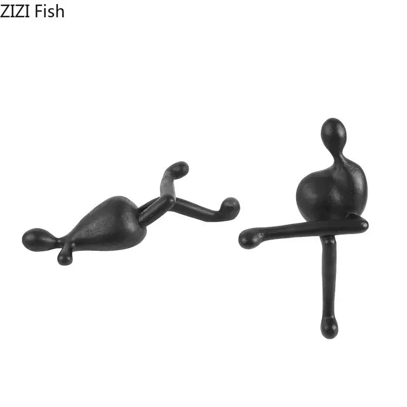 DecorBites abstract characters resin sculpture featuring black matte finish reclining and seated figures for modern decor