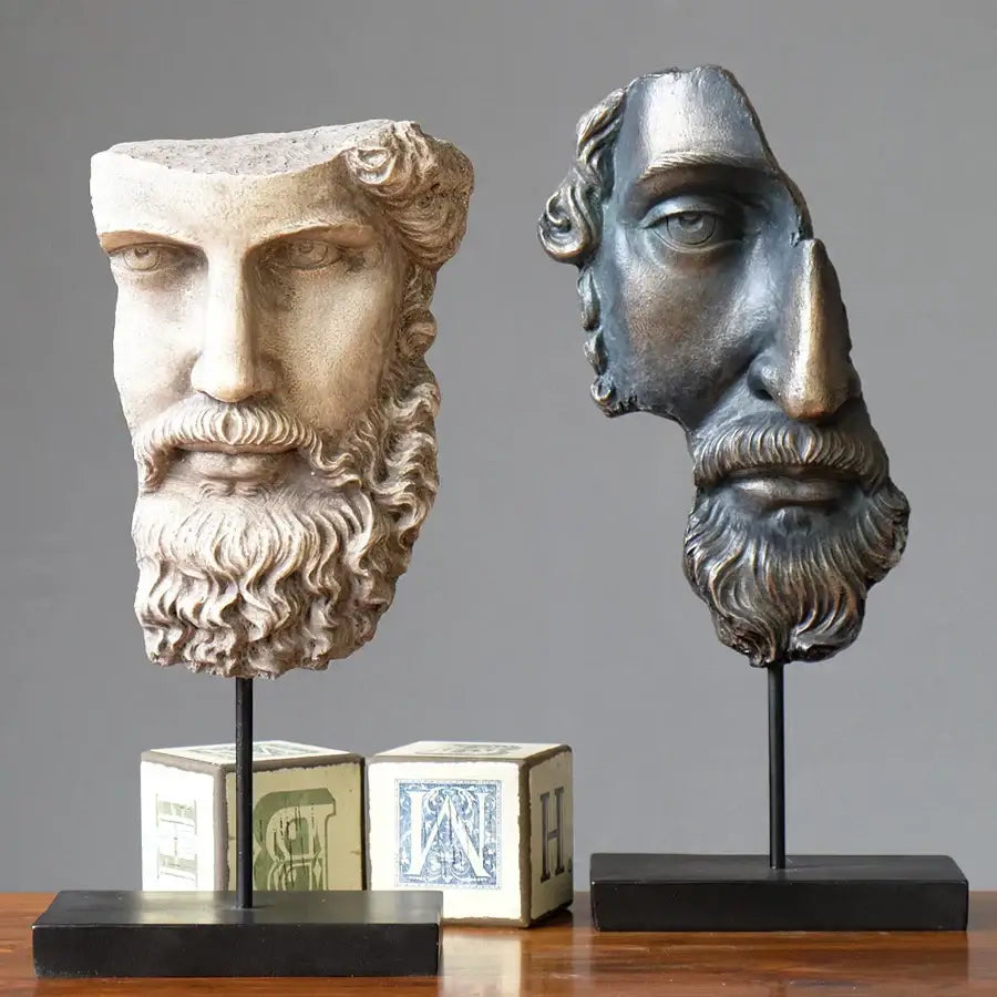 Two sculpted busts in aged beige stone and dark bronze resin from decorbites abstract david face sculpture collection