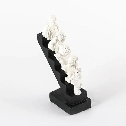 White resin decorbites abstract david statue sculpture featuring classical busts on a sleek black staircase base for home decor