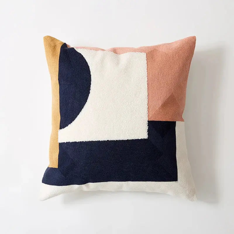 A decorbites abstract embroidered pillow cover featuring a textured geometric design in navy blue cream terracotta and mustard yellow