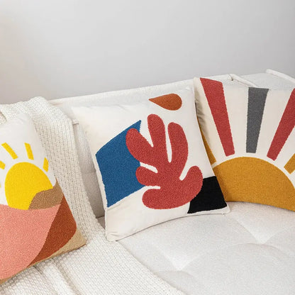 White soft velvet DecorBites abstract embroidery cushion cover with bold red, blue, and black shapes for sofa use