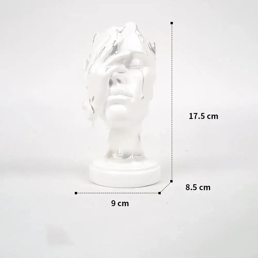 A glossy white ceramic bust sculpture featuring a decorbites abstract face mask design for home decor use