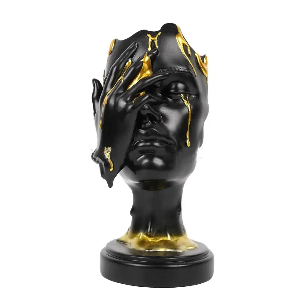 Black resin decorbites abstract face mask sculpture with gold liquid dripping on crown and hand for home decor