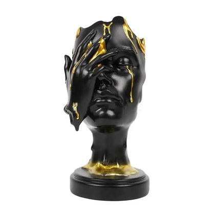 Black resin decorbites abstract face mask sculpture with gold liquid dripping on crown and hand for home decor