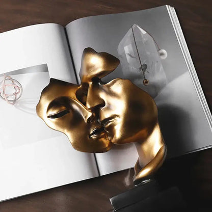 DecorBites™ abstract face sculpture ornament in golden metallic with smooth reflective surfaces for home decor and gifts