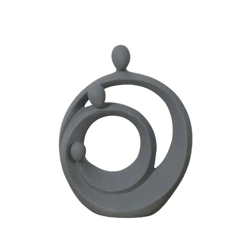 Gray abstract family sculpture set by decorbites featuring three rounded forms intertwined in concentric circular shapes