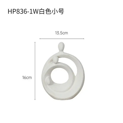 White ceramic decorbites abstract family sculpture set featuring interlocking circles with minimalist figures