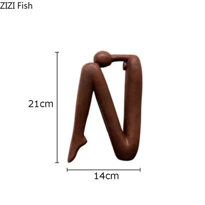 Brown decorbites abstract figure resin sculpture with stylized human form and smooth matte finish for modern decor