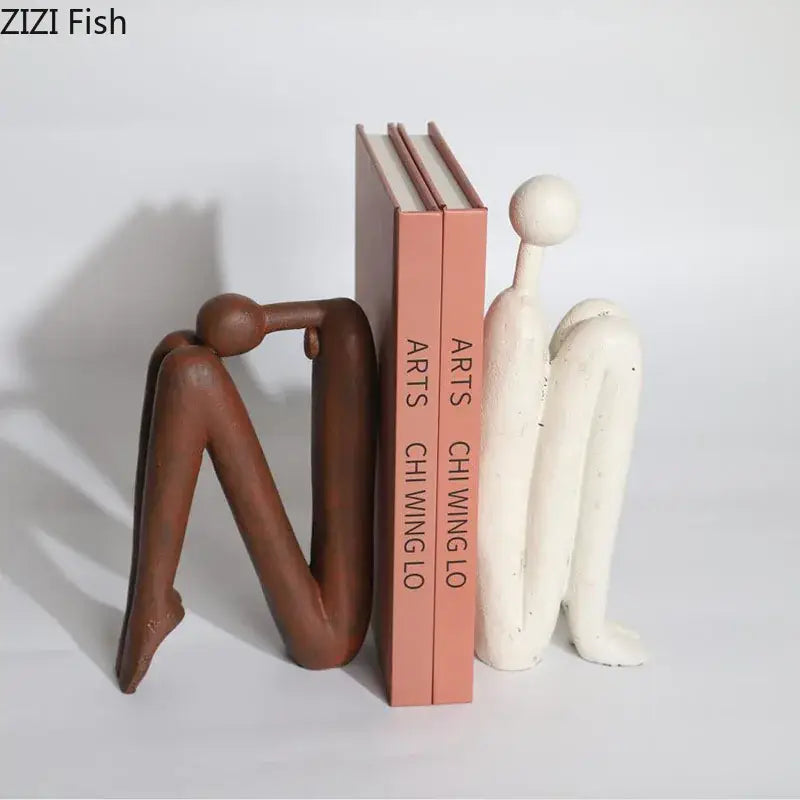 Decorbites abstract figure resin sculpture bookends in brown and white with smooth sculpted forms for modern desk decor