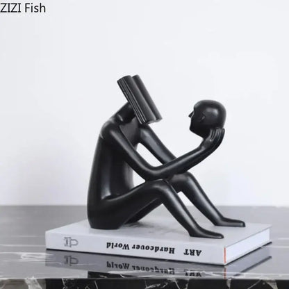 Black glossy resin decorbites abstract figure sculpture of seated figure with book head and book to face for room decor