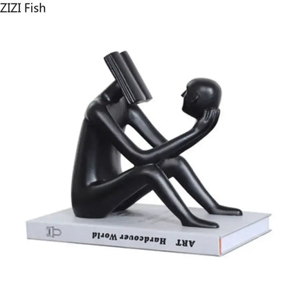 Black glossy resin decorbites abstract figure sculpture of two figures with book and resting head for room decor
