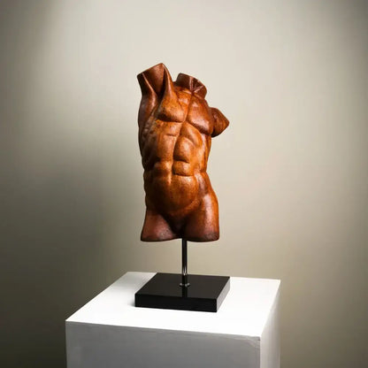 Bronze-colored muscular torso decorative figurine with detailed abs and draped fabric folds by decorbites abstract figure sculpture