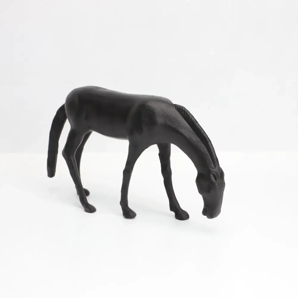 Decorbites abstract horse iron sculpture black matte finish with detailed mane and slender legs in grazing stance