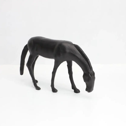 Decorbites abstract horse iron sculpture black matte finish with detailed mane and slender legs in grazing stance