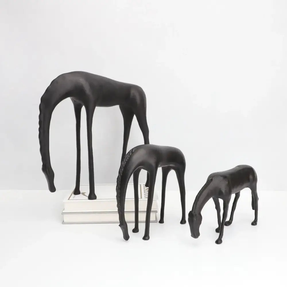 Set of three sleek black resin horse iron sculptures with elongated legs and stylized manes by Decorbites abstract horse