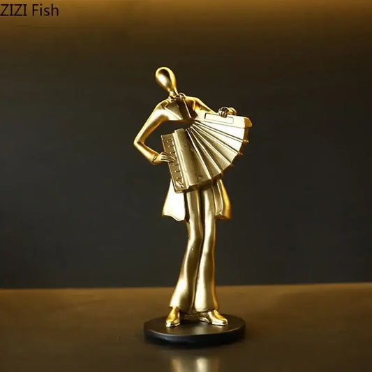 Golden metallic accordion musician resin sculpture on black base by decorbites for aesthetic room decor