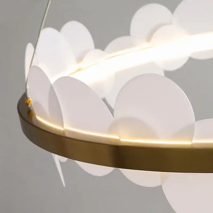 DecorBites™ modern acrylic ceiling chandelier with brass base and translucent white petals illuminated by warm led lighting