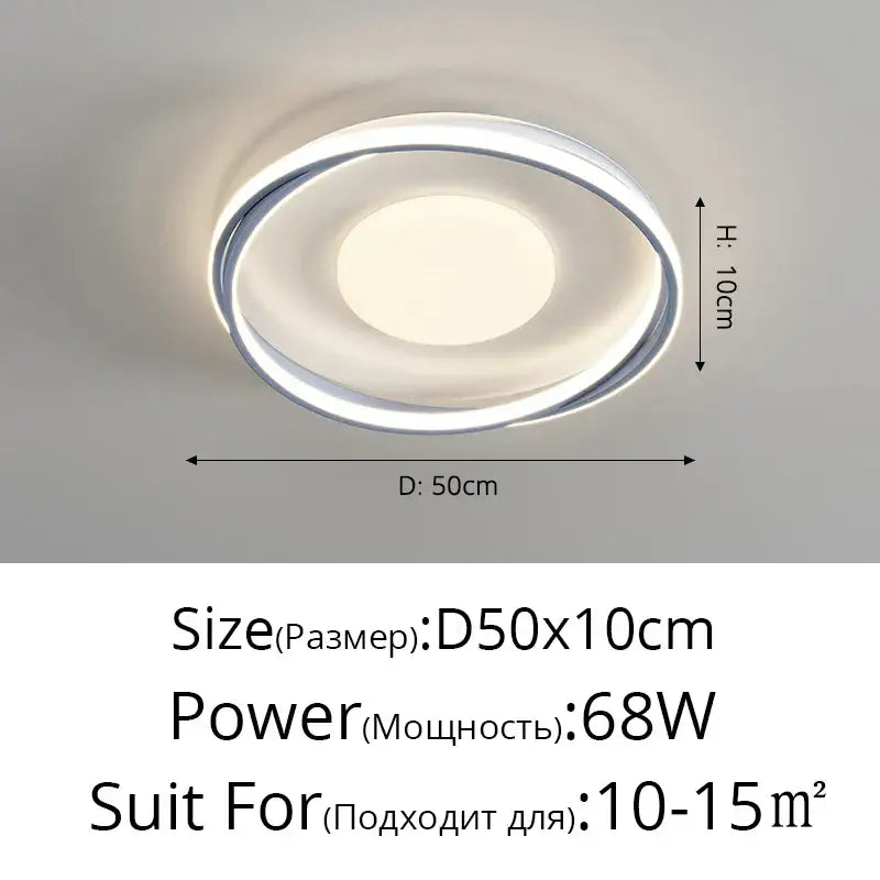 Modern circular acrylic chandelier with sleek chrome frame and soft white light for minimalist indoor spaces
