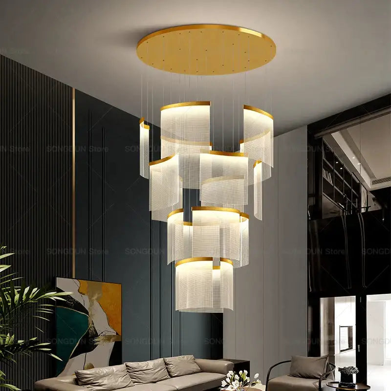 Gold-toned DecorBites™ acrylic chandelier with tiered translucent glass shades and metallic rings for modern nordic style lighting