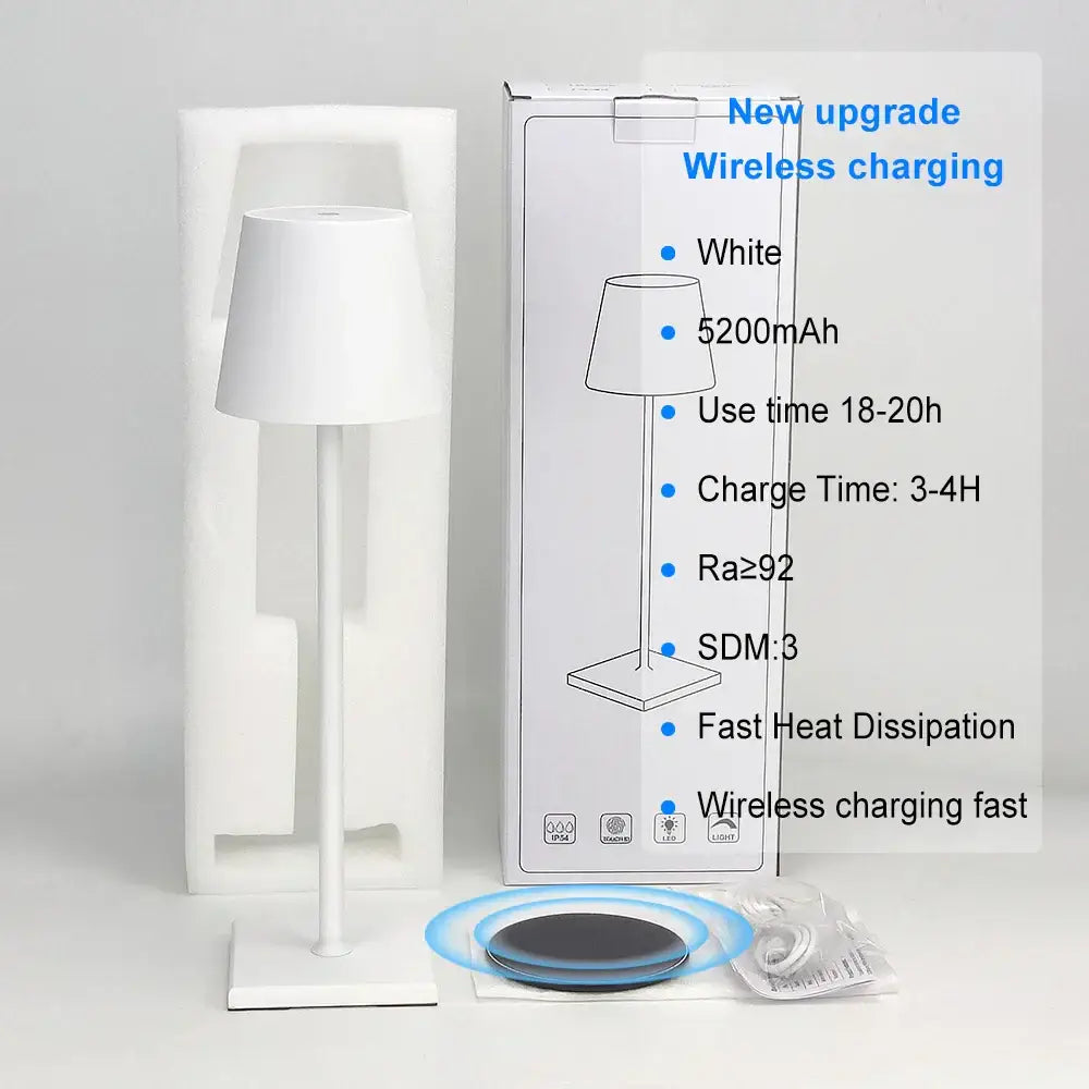 White minimalist DecorBites™ acrylic crystal art LED table lamp with sleek modern design and wireless charging pad nearby