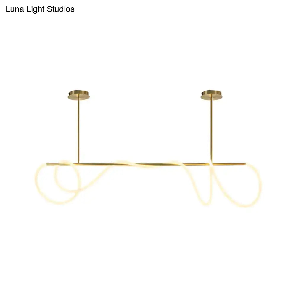 Gold-toned DecorBites acrylic flex tube suspension light with sleek LED rods providing natural ceiling light