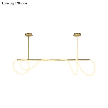 Gold-toned DecorBites acrylic flex tube suspension light with sleek LED rods providing natural ceiling light