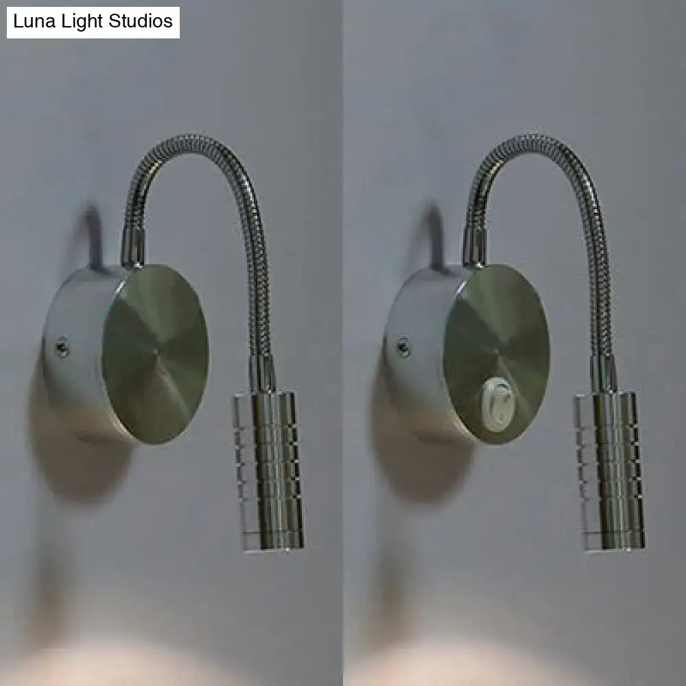 Modern chrome gooseneck cylinder wall mount reading lamp with a sleek silver-toned finish and textured cylindrical base