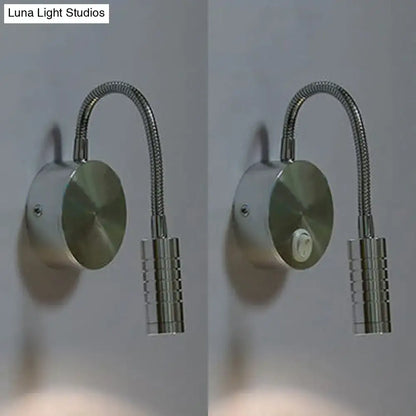 Modern chrome gooseneck cylinder wall mount reading lamp with a sleek silver-toned finish and textured cylindrical base