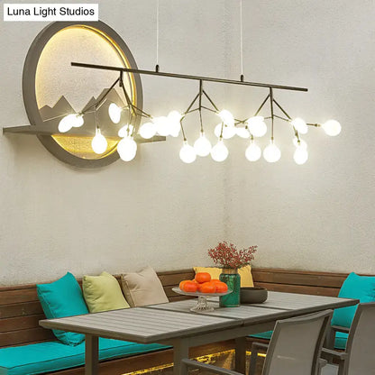 Modern black metal chandelier with multiple white bulbs in an adjustable hanging cord firefly metal pendant design