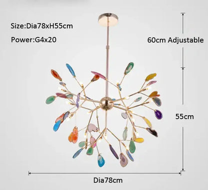 A modern decorbites agate branch chandelier with a brass fixture and colorful glass leaf shades for dining rooms