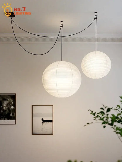 Two spherical white paper pendant lights by decorbites akari noguchi led hang from ceiling for living room decor