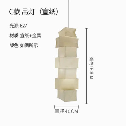 A modern DecorBites™ akari noguchi floor lamp with stacked translucent off-white rice paper cubes and metallic frame