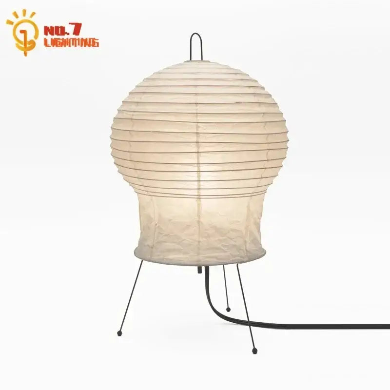 Beige akari noguchi rice paper table lamp with black metal stand and cord for modern living room lighting