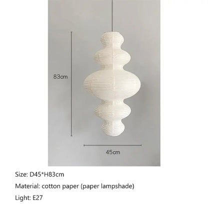 White intricately pleated cotton akari rice paper pendant lamp with tiered sculptural design for living room or bedroom