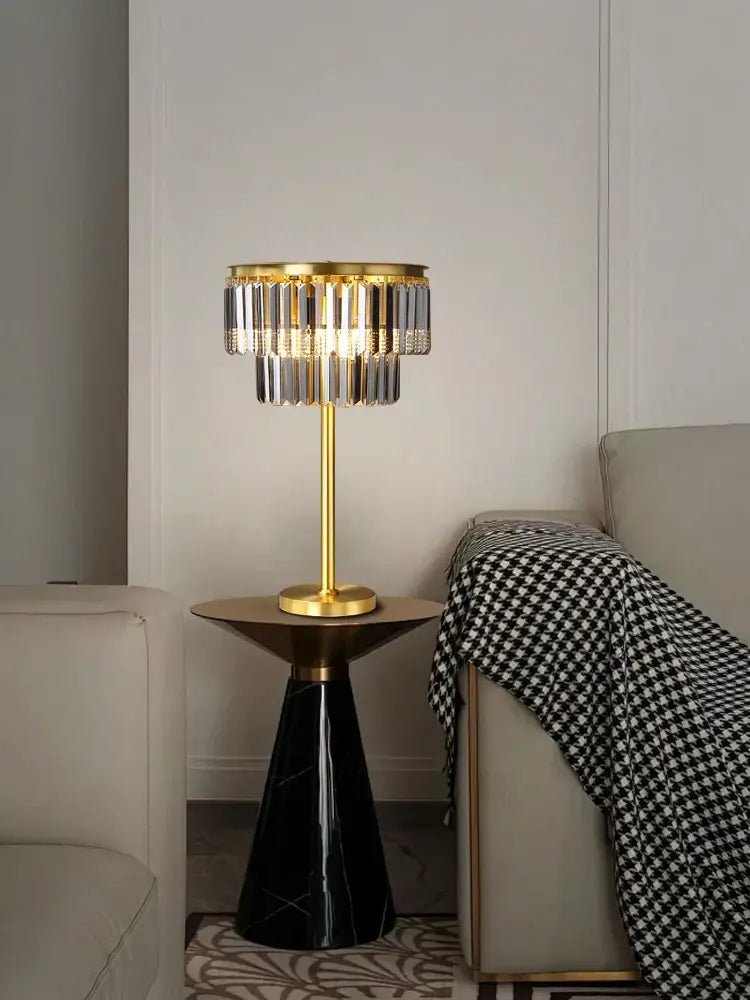 Gold-toned brass crystal floor lamp with clear and smoked prisms on black marble base for luxury living room decor