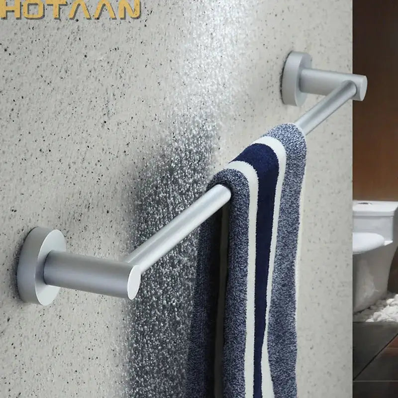 Silver aluminium DecorBites™ towel bar rail holder with anti-rust finish holding navy and white striped towel
