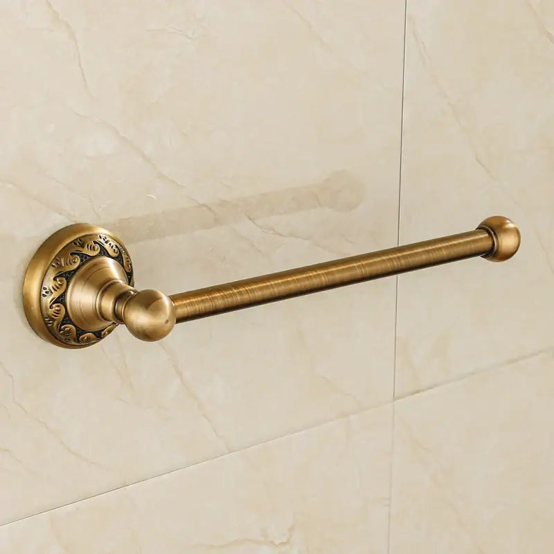 DecorBites aluminium wall mounted towel holder in antique brass with ornate circular base and polished spherical ends