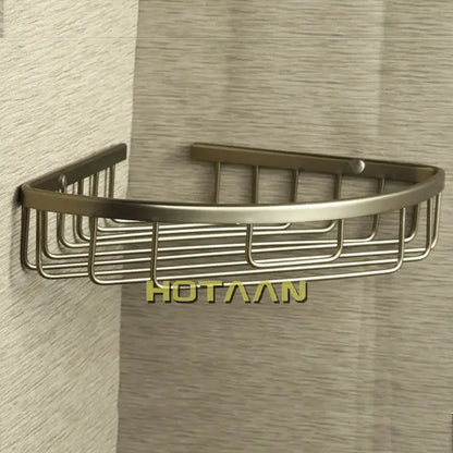 Bronze-finished aluminum shower basket holder shelf with sleek curved design and vertical wire grid for bathroom use