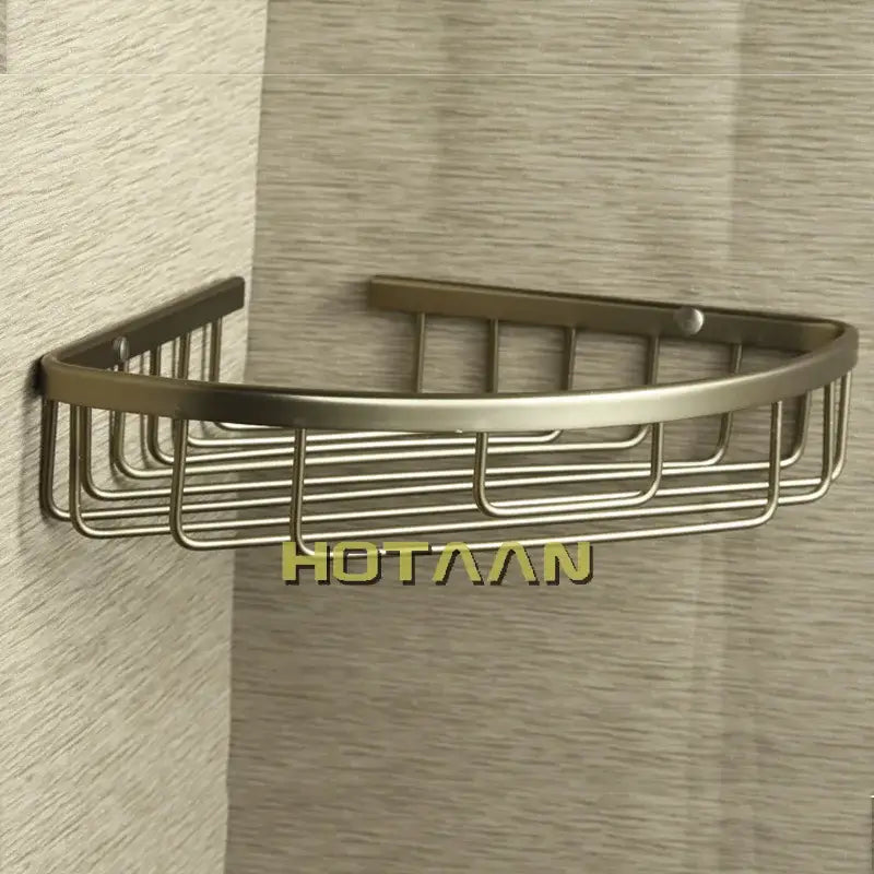 Bronze-finished aluminum shower basket holder shelf with sleek curved design and vertical wire grid for bathroom use