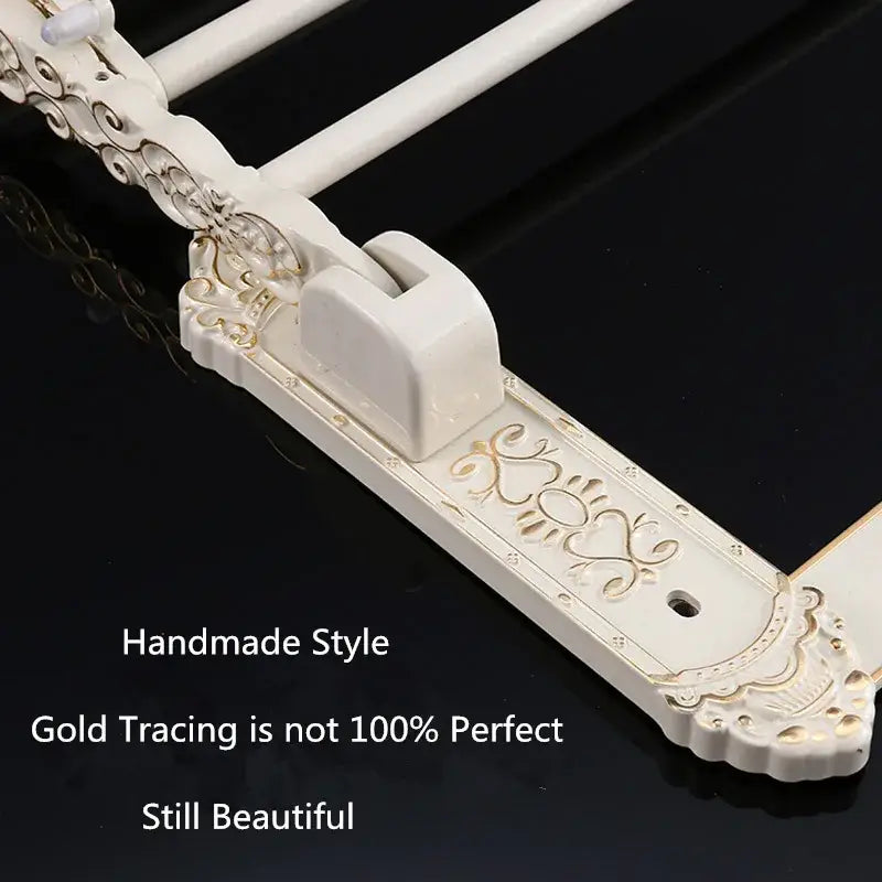 DecorBites™ aluminum bath hardware set featuring white ornate metal curtain rod with gold tracing and decorative latch