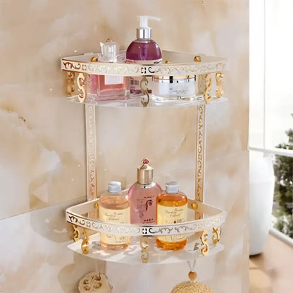Clear glass bathroom corner shelf with ornate gold trim and decorative scrollwork by decorbites aluminum basket