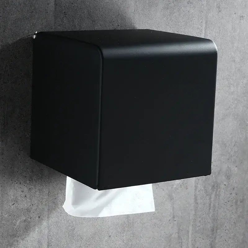 Black matte DecorBites aluminum wall-mounted toilet paper rack with modern cube design for bathroom tissue holder