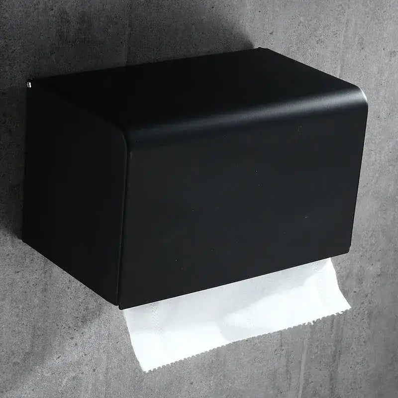 Black matte-finished metal toilet paper holder with sleek rectangular design for bathroom roll storage by DecorBites